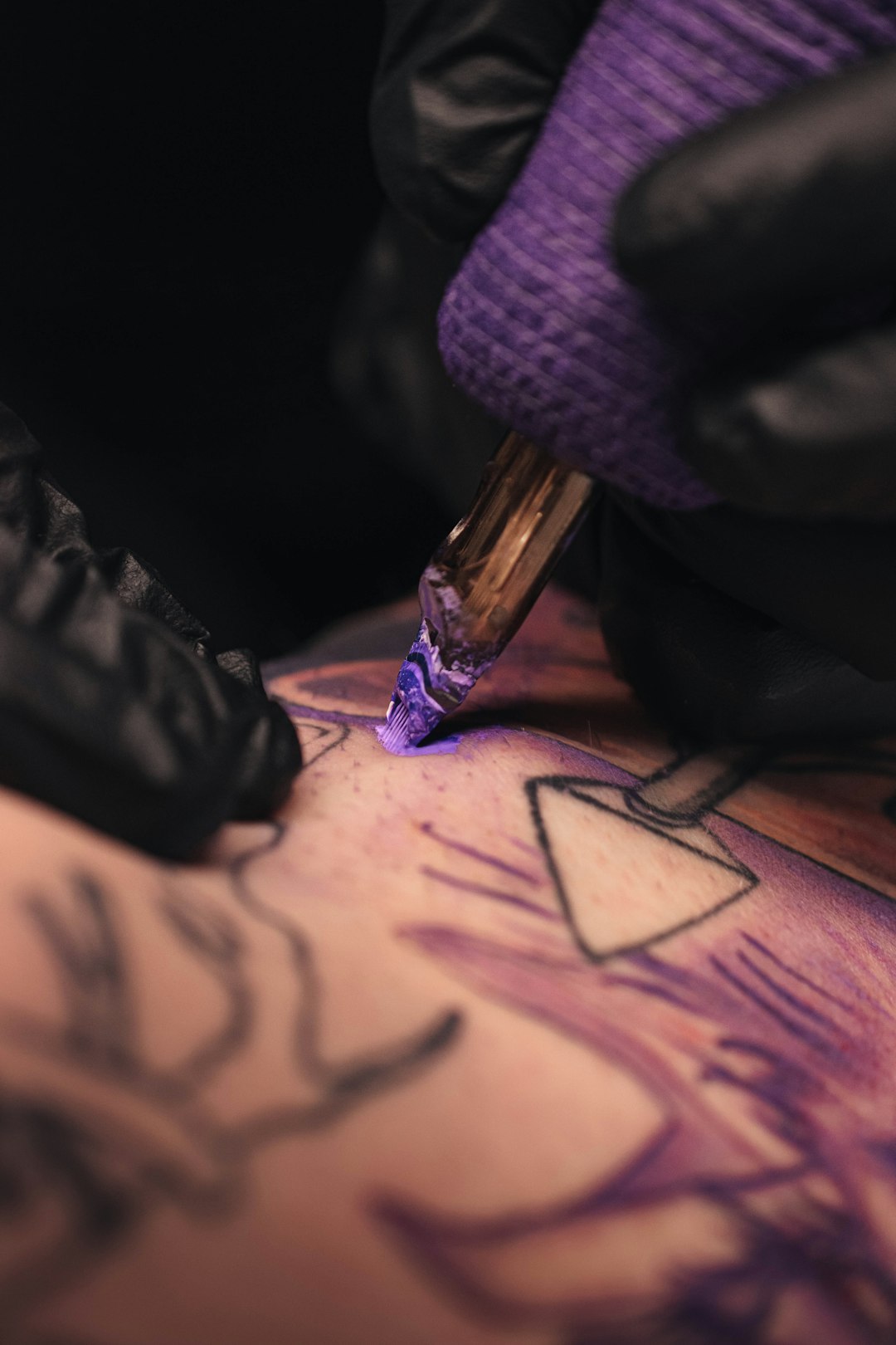 a-person-getting-a-tattoo-done-by-a-tattoo-artist-nhy4or4khxm