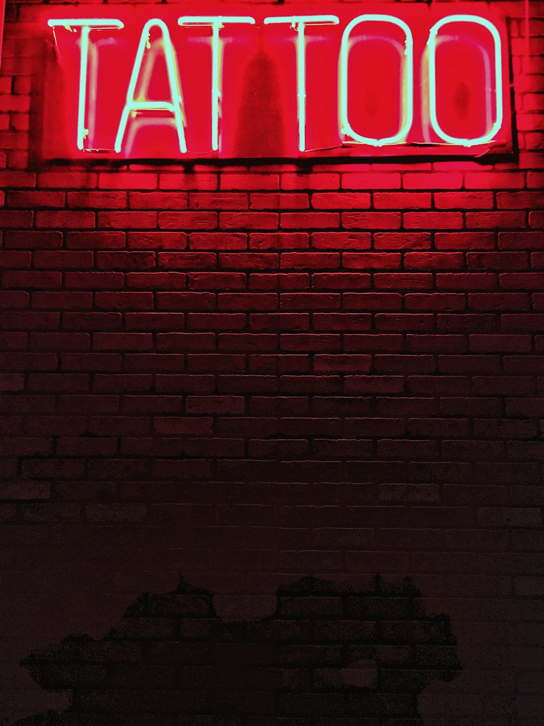 red-tattoo-neon-light-signage-ajd3xjlvbz8