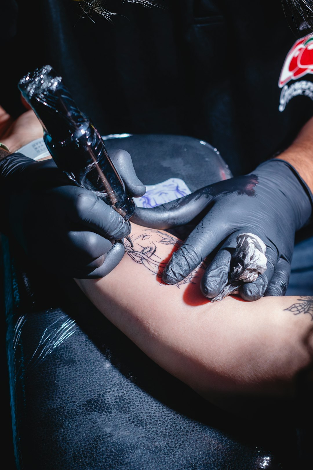 tattoo-artist-inks-a-design-onto-an-arm-r8dzfuqf9i8